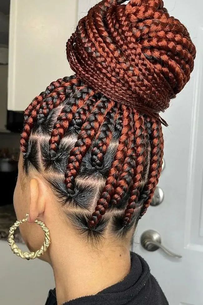 High bun with intricate geometric tribal braids