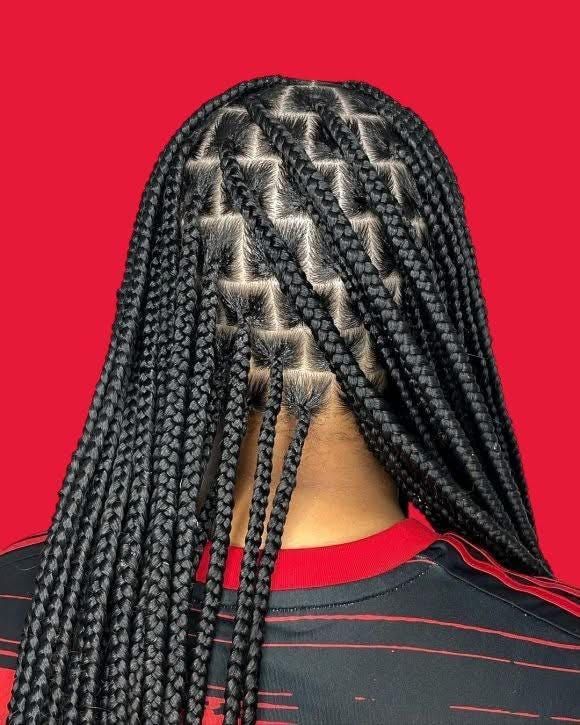 Zigzag pattern knotless braids with red background